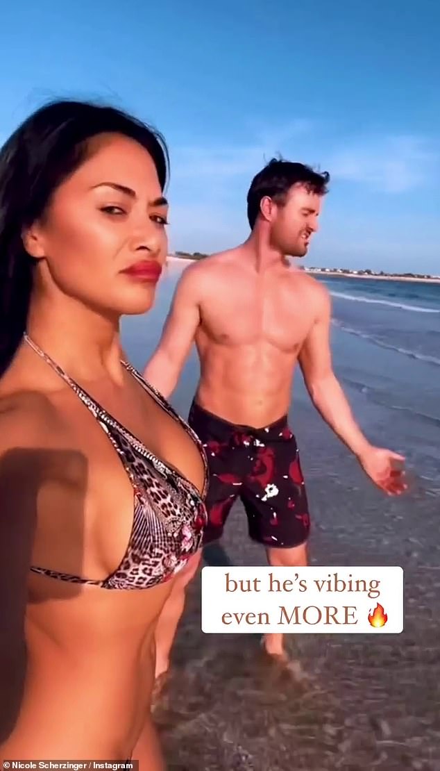 Nicole Scherzinger and Thom Evans lark about on UAE beach during their SIXTH holiday of the year 1