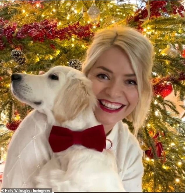 Holly Willoughby dazzles as she sports classic red lipstick and poses with loveable new puppy Bailey