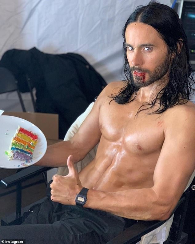 Jared Leto shows off his sculpted chest and washboard abs as he goes shirtless on his 50th birthday