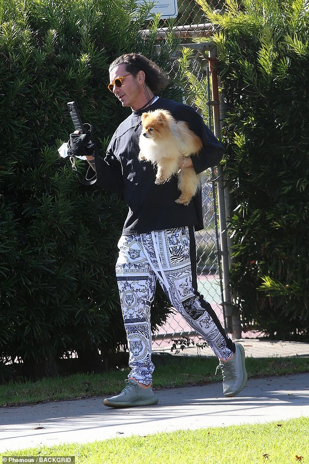 Gavin Rossdale walks his dog Chewy donning luxe print pants … in between rain spells in LA 1