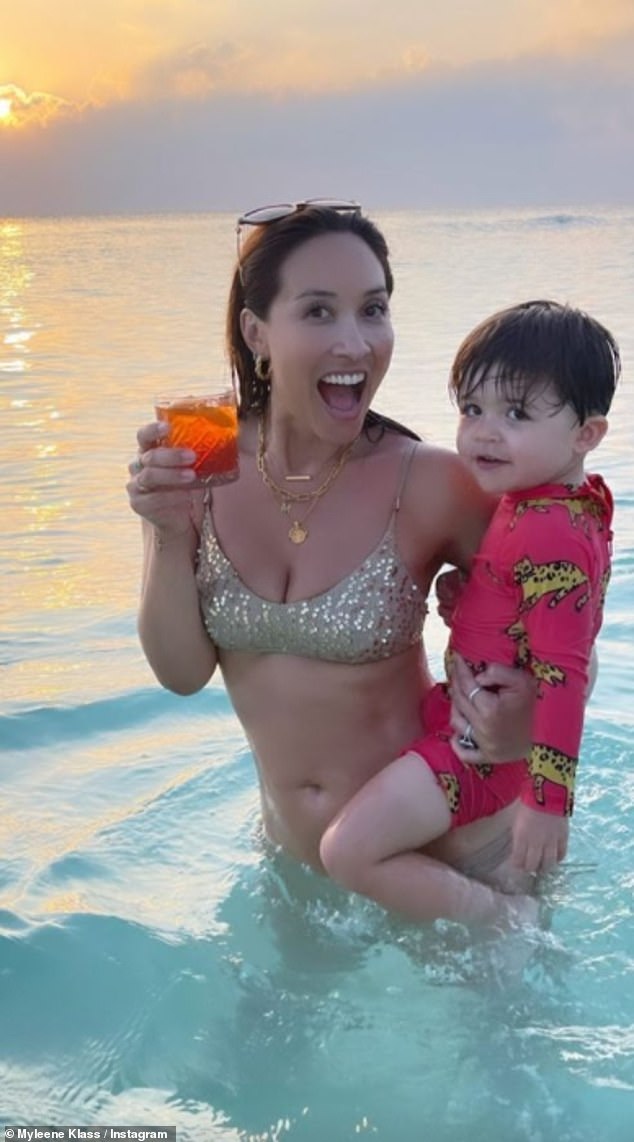 Myleene Klass, 43, dons a sparkly gold bikini as she poses with son Apollo, 2, during Maldives trip
