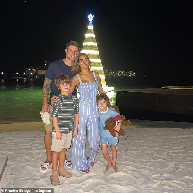 Frankie Bridge dons a blue jumpsuit during sun-soaked getaway with husband Wayne and their sons 1