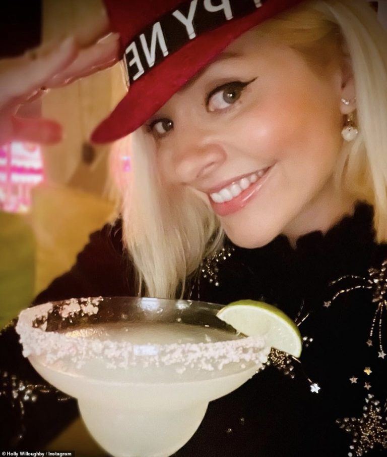 New Year: Holly Willoughby glamorous as she enjoys a margarita while Cruz Beckham shares family snap