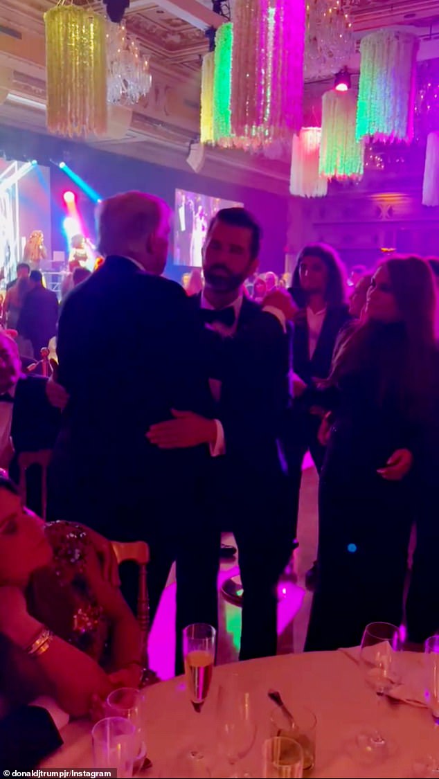 Don Jr. gets a huge hug from dad Donald on NYE for his birthday at Mar-a-Lago 1