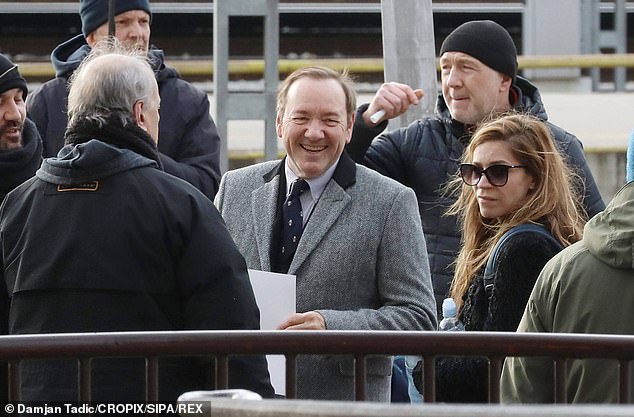 Disgraced Kevin Spacey cracks a smile as he films alongside director Jakov Sedlar in Croatia