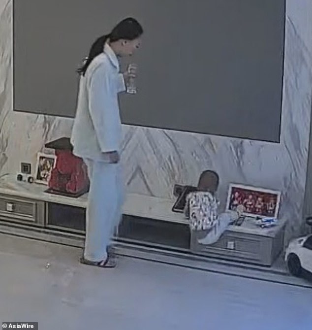 ‘Groggy’ mother sticks out her foot to stop her baby’s head hitting the floor [video]