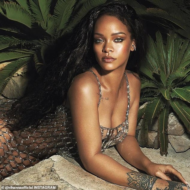 Rihanna stuns in nothing but a diamond dress after her release of her lingerie collection
