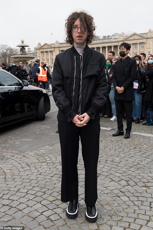 Mick Jagger’s son Lucas, 22, channels his dad’s edgy look with messy curled hair at PFW show