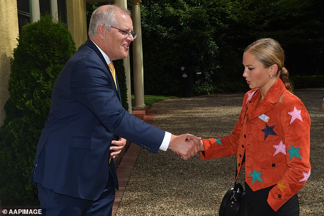 Divisive Australian of the Year Grace Tame looks furious as she meets with Scott Morrison 1