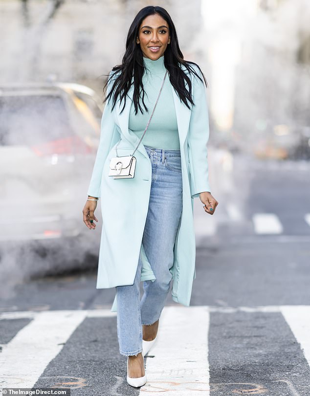 Tayshia Adams turns the street into her runway in mint top and blue jeans for photoshoot in New York