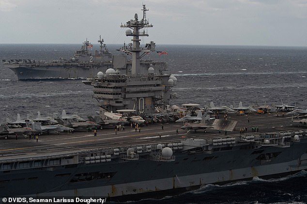 Seven sailors on board the USS Carl Vinson are injured as a fighter jet suffers a 'landing mishap' 1