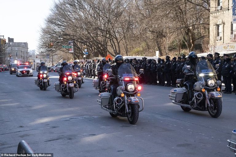 Hundreds of cops line the streets of Manhattan to salute body of fallen hero NYPD officer