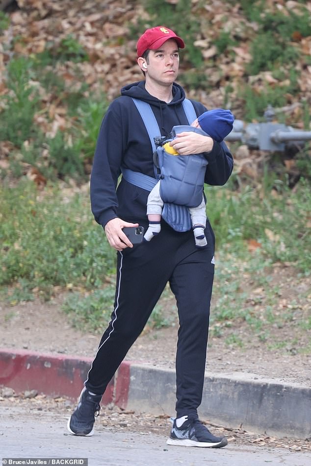 John Mulaney takes son Malcolm on a walk… as Olivia Munn shares adorable new video of their baby