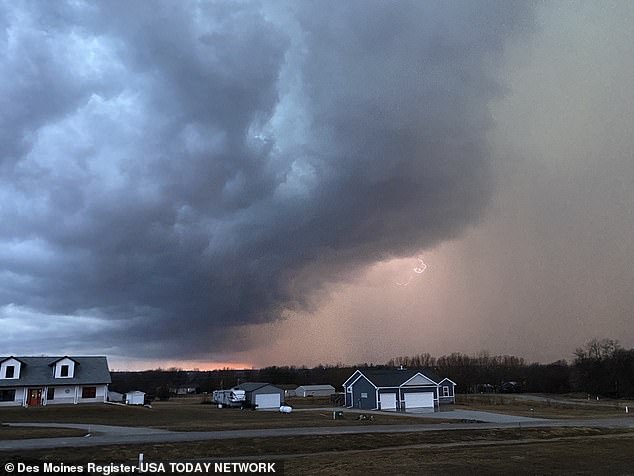 Two people are killed as a tornado sweeps through rural Iowa with strong winds up to 165mph
