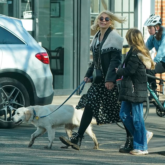 Holly Willoughby wraps up warm as she takes puppy Bailey for a walk with her daughter Belle