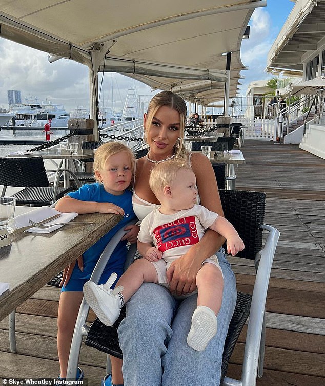 Skye Wheatley flaunts her ample assets in a sheer white corset as she enjoys lunch with her sons