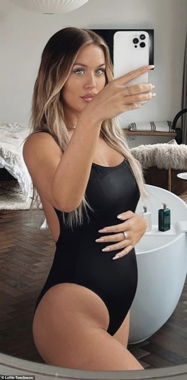 Pregnant Lottie Tomlinson cradles her blossoming baby bump in swimsuit selfie