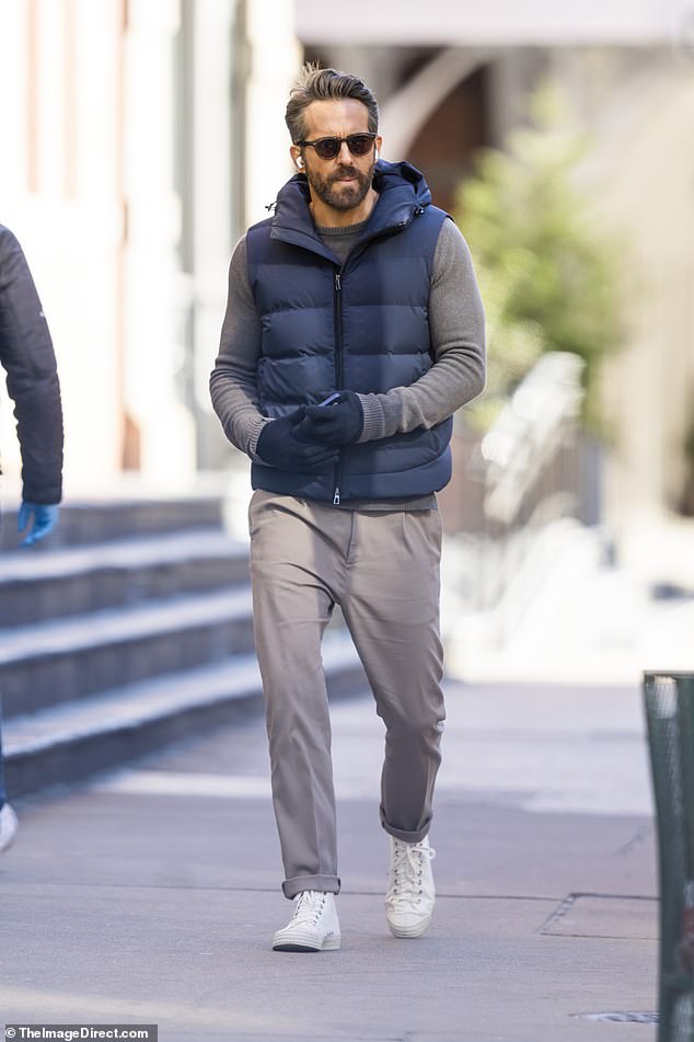 Ryan Reynolds sports blue hooded puffer vest for NYC stroll