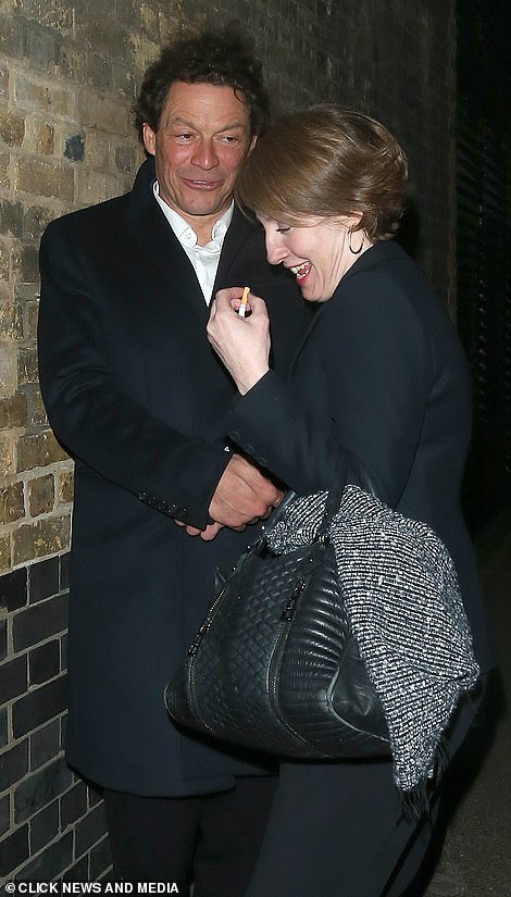 Dominic West staggers into his hotel while being held up by a female pal after partying till 4am