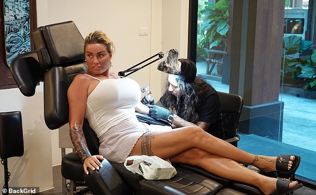 Katie Price shows off boob job as she gets unicorn tattoo during Thailand trip with Carl Woods