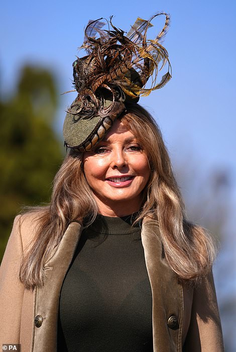 Carol Vorderman is the epitome of chic in a taupe ensemble at day four of Cheltenham Festival