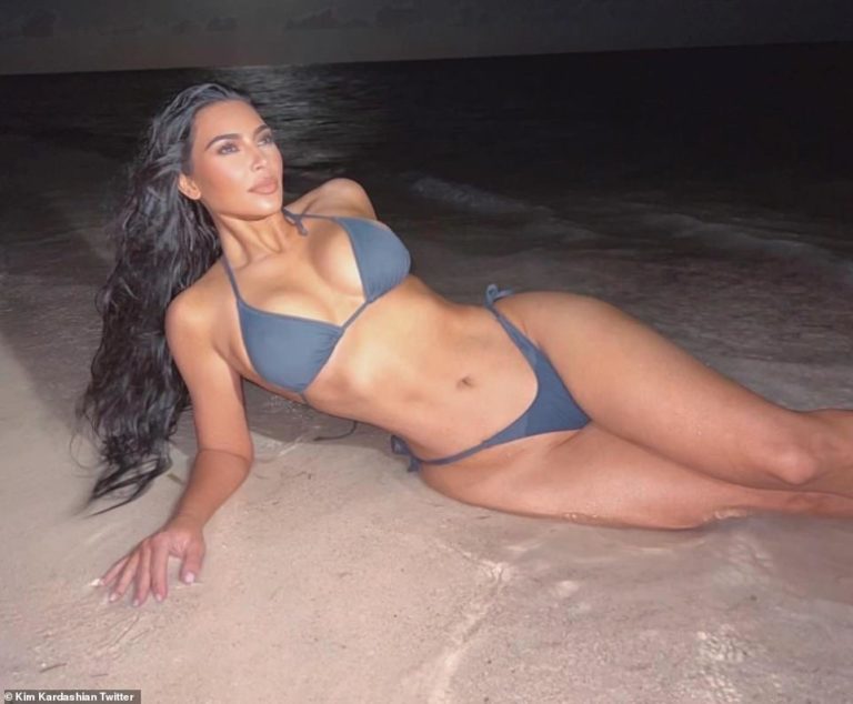 Kim Kardashian shares sultry beach snaps showing off her enviable curves as she launches SKIMS Swim