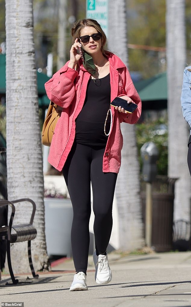 Katherine Schwarzenegger shows off baby bump in form-fitting shirt as steps out for breakfast in LA