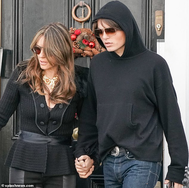 Liz Hurley holds son Damian’s hand on eve of Shane Warne’s funeral