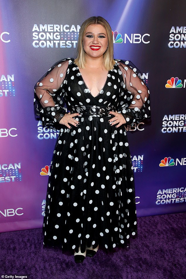 Kelly Clarkson dons low-cut polka dot dress as she attends the premiere of American Song Contest