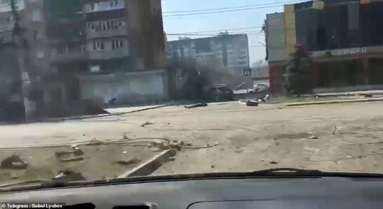 Footage shows civilians weaving their car between dead bodies in apocalyptic scenes from Mariupol