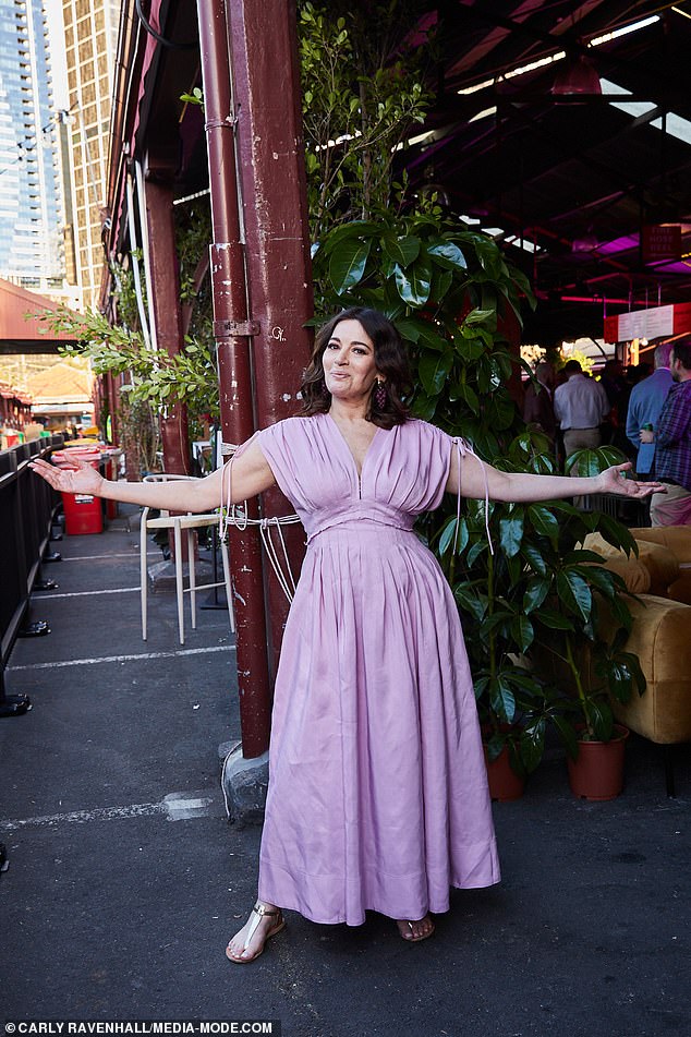 Nigella Lawson shows off her curves in a pretty purple dress at Melbourne Food & Wine Festival