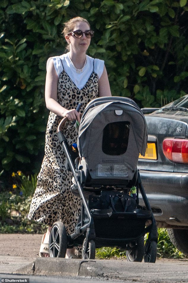 Katherine Ryan dons a leopard print maxi dress as she enjoys stroll with her son Fred, 9 months