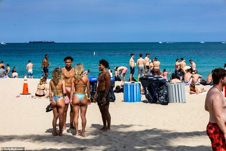 Spring breakers soak up the sun in Miami Beach ahead of 6pm liquor ban and midnight curfew