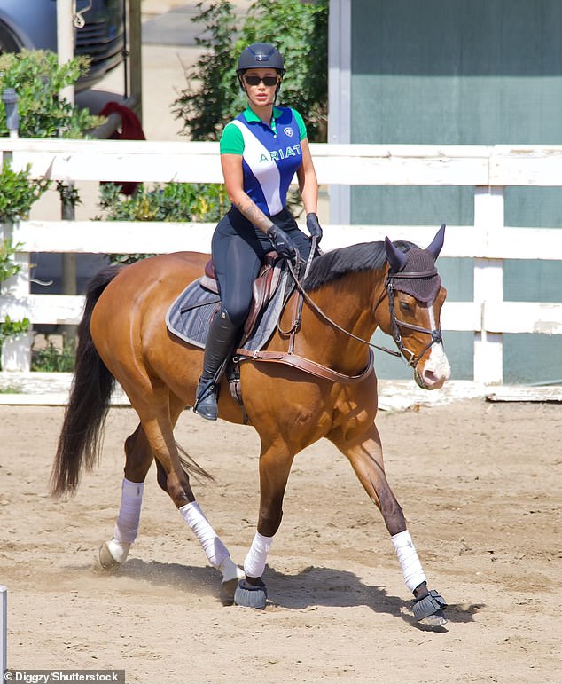 Iggy Azalea wears tight jodhpurs during a horse riding lesson in Malibu
