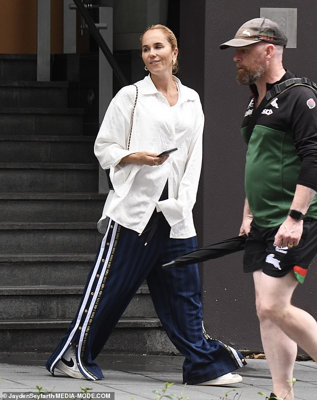 Pip Edwards, 41, covers up her fit figure in a pair of baggy tracksuit pants and a flowing top