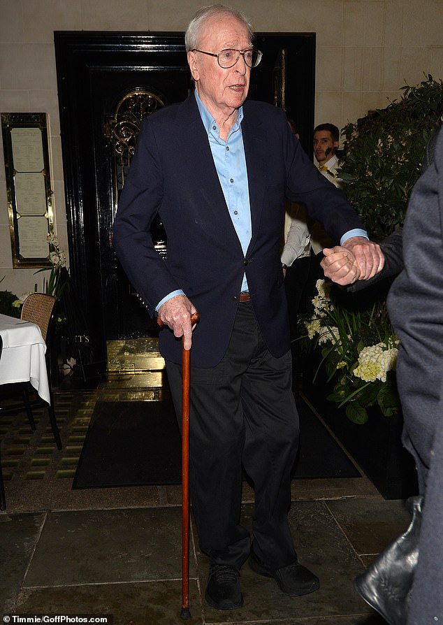 Sir Michael Caine, 89, steps out using a cane for a date night with his glamorous wife Shakira, 74