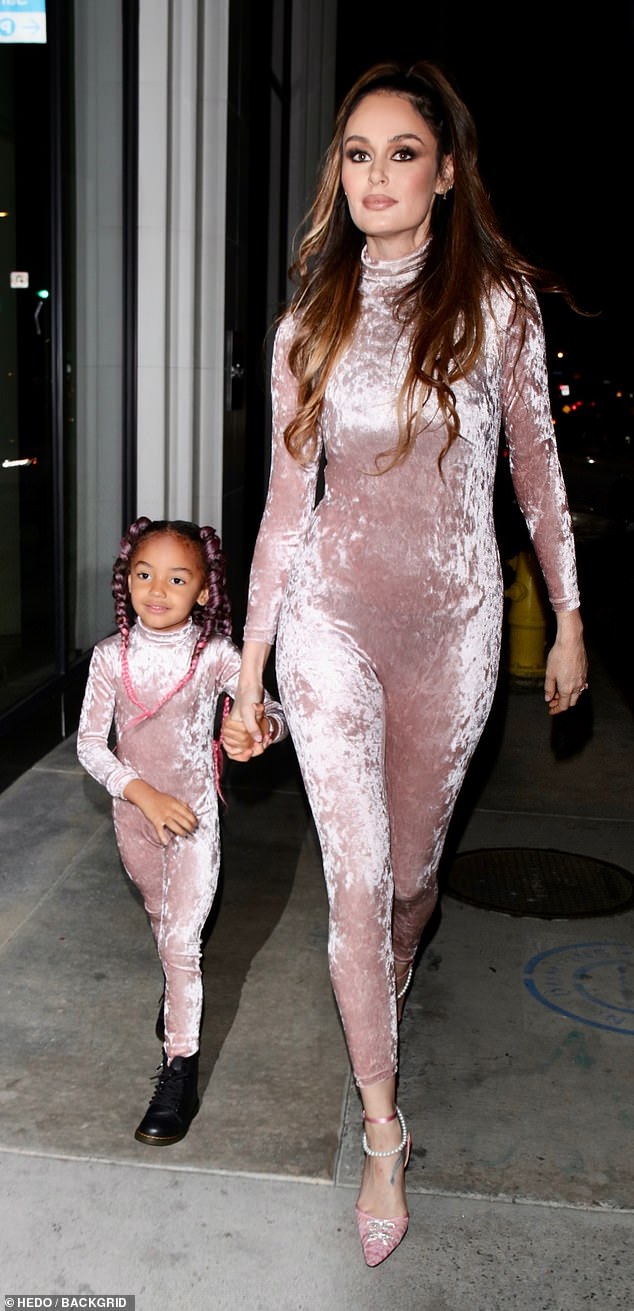 Nicole Trunfio and daughter Gia, four,  step out in crushed velvet jumpsuits for dinner