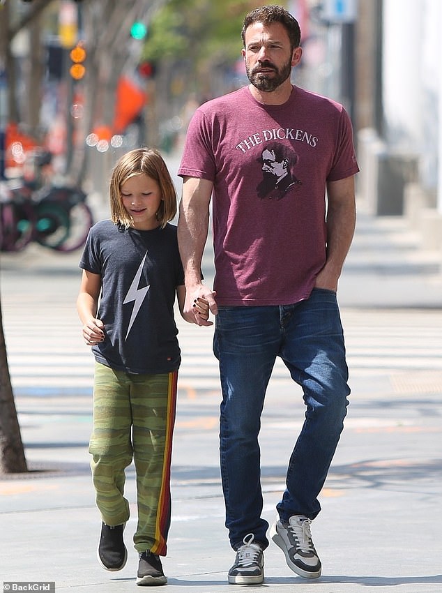 Ben Affleck is every inch the doting dad as he holds hands with son Samuel in Brentwood
