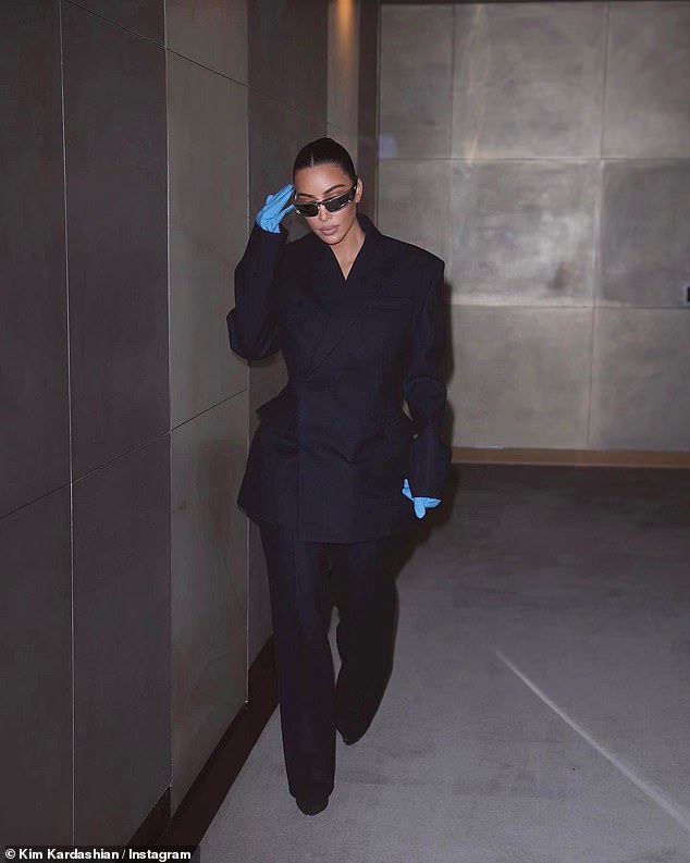 Kim Kardashian channels lawyer chic as she covers her iconic curves in an oversized suit