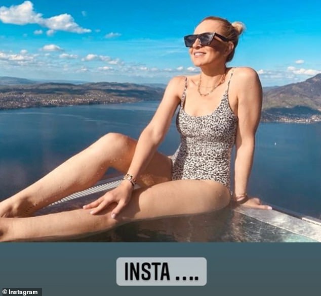 Carrie Bickmore shows off her age-defying figure in a leopard-print swimsuit