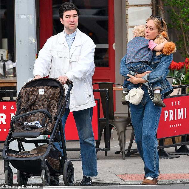 Chloe Sevigny is every inch the doting mother as she carries her young son Vanja while stepping out