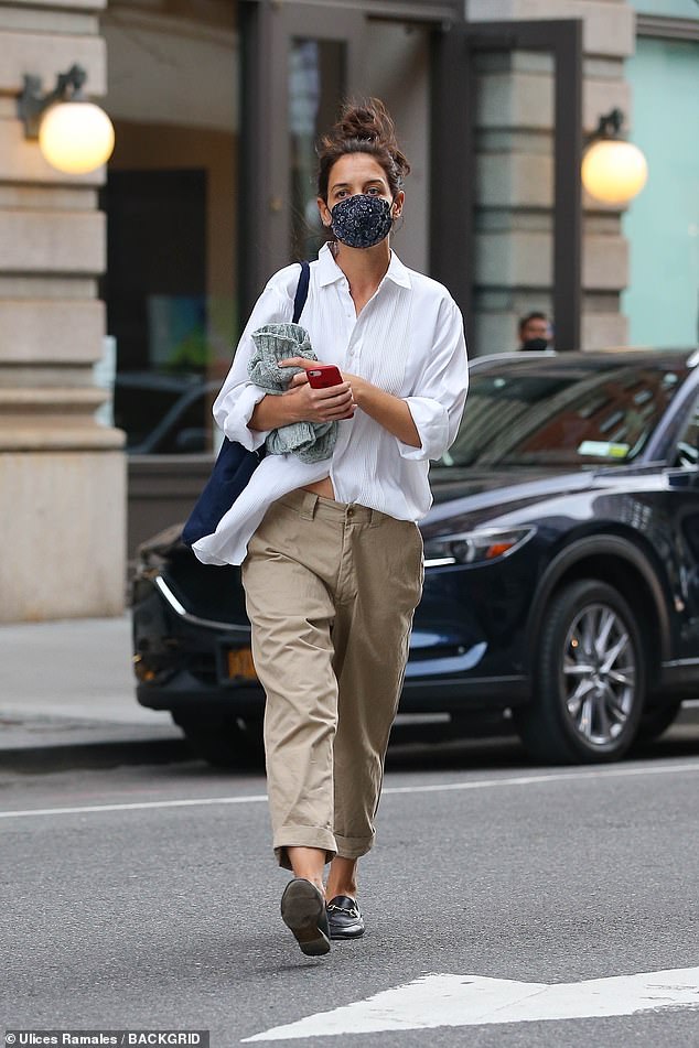 Katie Holmes cuts casual figure in a white button-down shirt and khaki pants while out in NYC