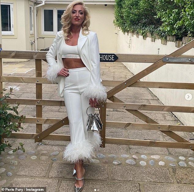 Pregnant Paris Fury shows off her midriff in stylish white ensemble ahead of husband Tyson’s fight