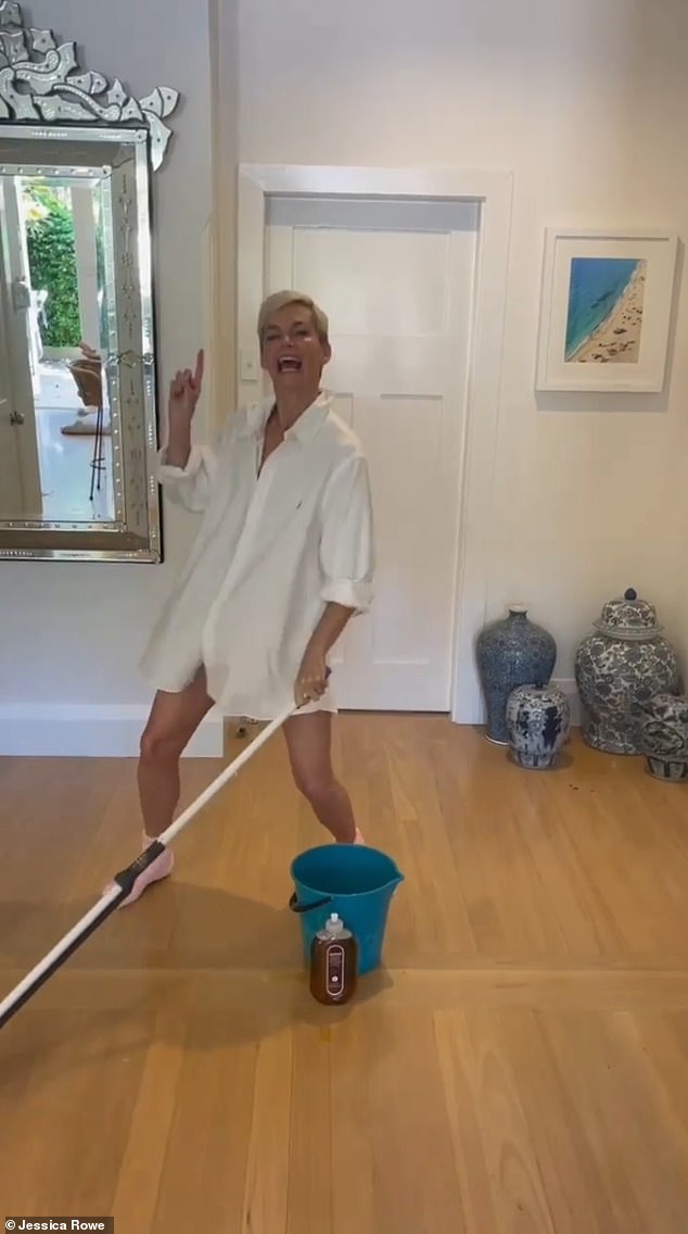 Jessica Rowe channels Tom Cruise in Risky Business as she dances around her house mopping