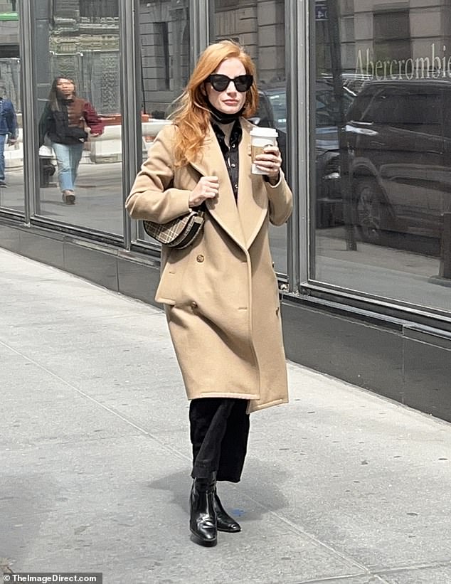 Jessica Chastain looks chic in a tan trench coat as she grabs her caffeine fix in New York