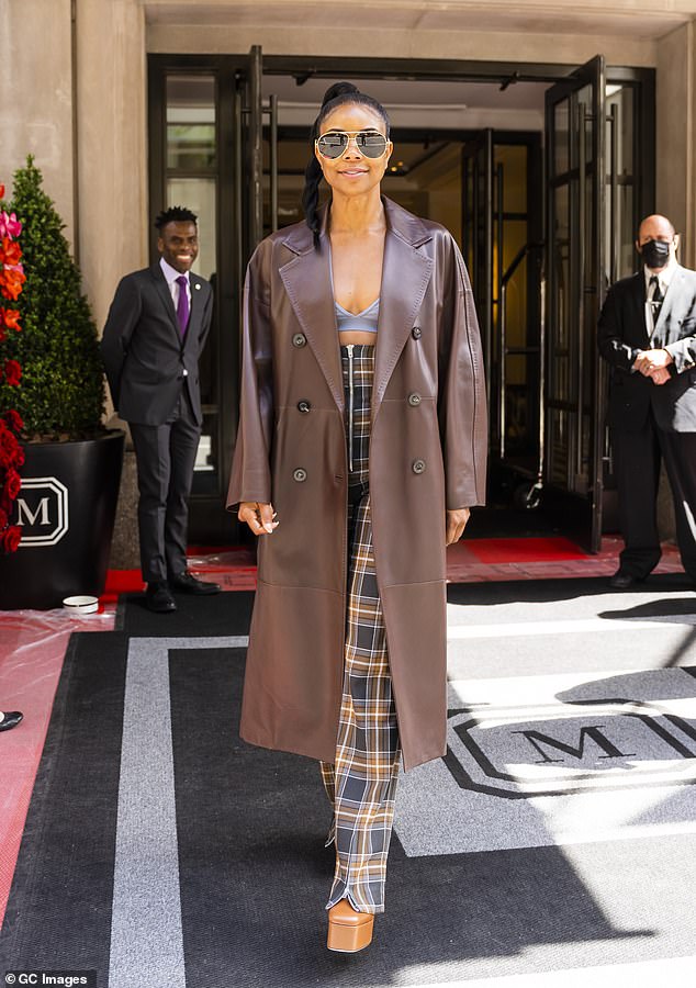 Gabrielle Union stuns in leather duster coat, plaid trousers and platform shoes during errand run