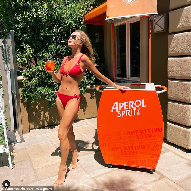 Amanda Holden, 51, shows off her incredibly toned physique in red bikini for throwback snap