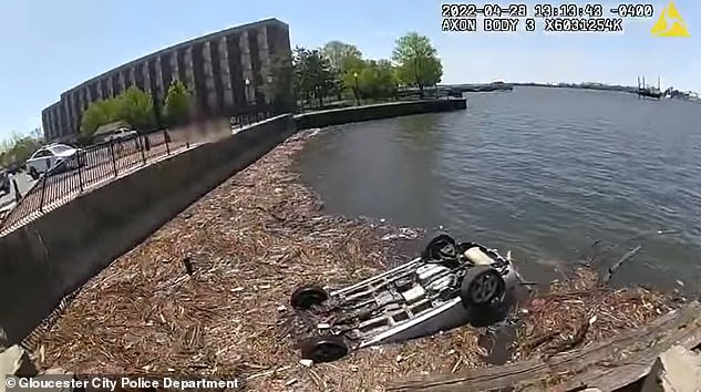 Heart stopping moment New Jersey cops rescue woman from overturned car