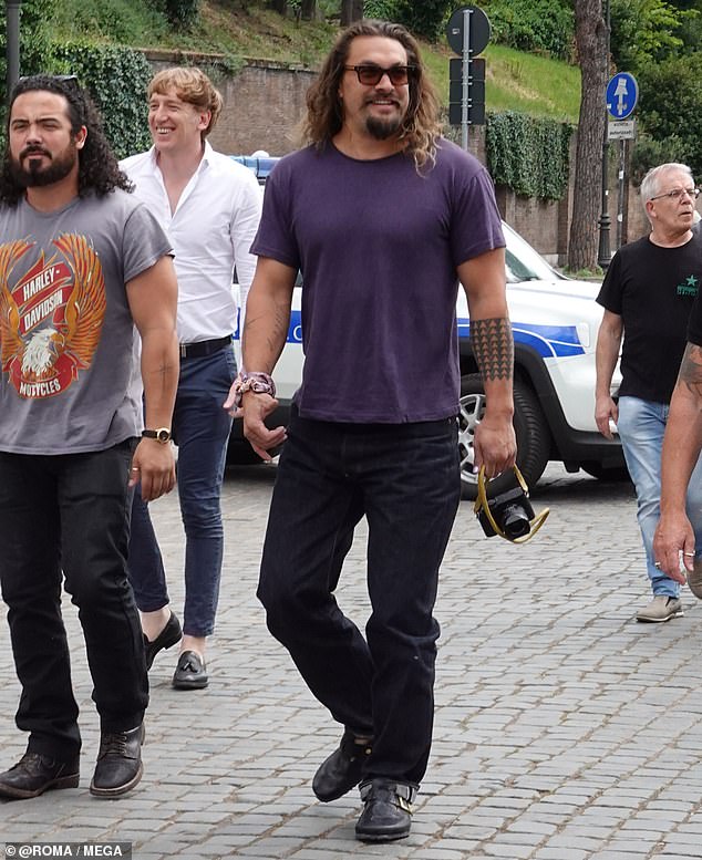 Jason Momoa shows off his muscular frame while sightseeing in Rome during Fast and Furious day off