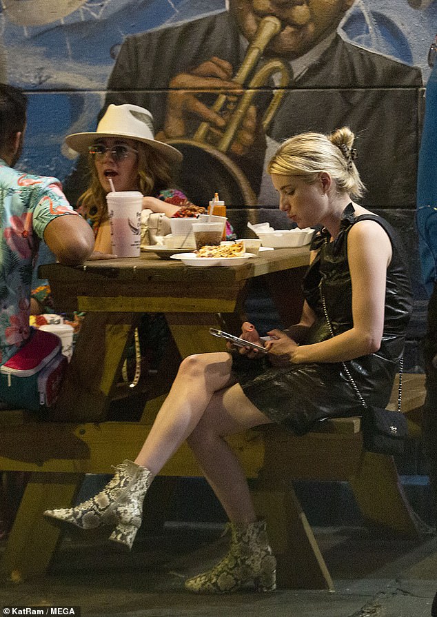 Emma Roberts chats up mystery men as she lives it up during night out in New Orleans 
